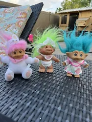This set of three Russ troll dolls is a must-have for any collector of vintage dolls. Each doll in the lot is a unique...