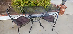 3 piece outdoor bistro set: 1 table and 2 chairs with cushions, bonus 3rd chair (no cushion, slight rust), Black metal...