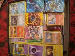 2000 cartes Pokémon/ex/full art/holographique+4 livres de rangements. État : 