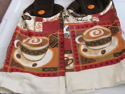 BOTH TOWELS HAS A CUP OF COFFEE. BOTH TOWELS HAVE A BROWN YARN CROCHET TOP WITH AN ORANGE BUTTON.