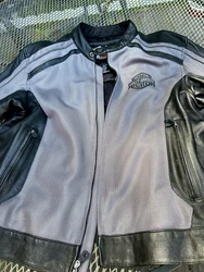 Here is an authentic Harley-Davidson riding jacket in mesh nylon with lots of black leather trim and armor, size XL....