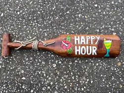 BEAUTIFUL HAPPY HOUR PADDLE IT IS HAND CARVED WOOD AND HAND PAINTEDIT IS CARVED WITH GREAT DETAILTHE SIZE IS 20”...