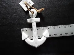 This is a 5 in X 7 in Anchor,it is white and hangs on the wall with the rope attached to it.