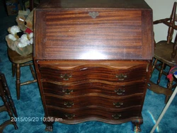 This is an antique secretary desk from an estate. One of the fold down desk supports seems to be missing but it seems...