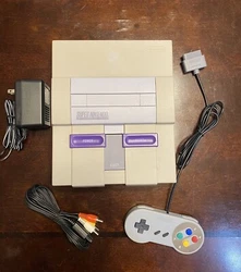 Super Nintendo SNES SNS-001 w/controller and power/video cables. You are bidding on a used Super Nintendo entertainment...