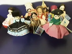 The lot includes 9 dolls.