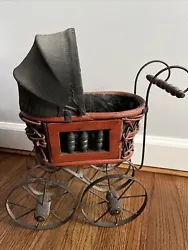 Vintage Victorian Baby Doll Buggy Stroller Carriage Metal and Wood 15” Tall, 12” Long, 7.5” Wide. Has some rust...