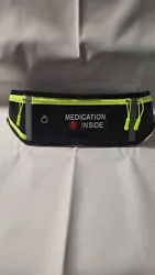 Medication fanny pack, waist bag, features three front pockets. Holds a water bottle in the side compartment, center...