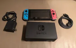 Nintendo Switch 32GB Handheld Console - Neon Red/Neon Blue.Console is in good conditions it includes console joycons,...