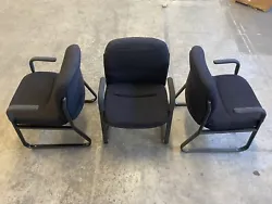 Standard Height Office Chair. Padded black fabric and metal finish with arm rests. Price is for each chair. Total of 10...
