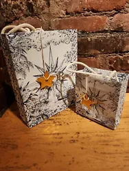 2 DIOR AUTHENTIC FANCY PAPER SHOPPING BAGS WITH STAR CHARM.(MEDIUM BAG SIZE LENGTH 10 INCHES WIDTH 8 INCHES DEPT 3.4...