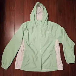 Stay dry and stylish with this mint green windbreaker from The North Face.
