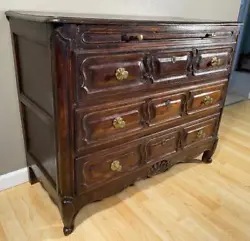 This elegantLouis XV commode/chest of drawers is from France and it dates to the early/mid-1900s. The side panels, back...