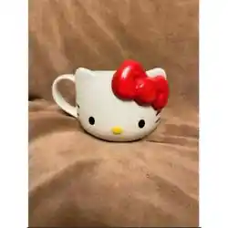 Cute mug features Hello Kitty with her signature big red bow. Hand was only, not for use in microwave or dishwasher.