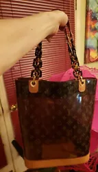 LOUIS VUITTON Monogram Cabas Ambre Cruise Collection Vinyl Leather and gold hardware with attached leather zip closure...