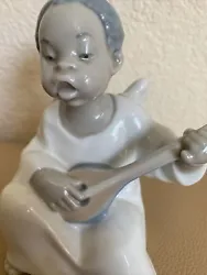 Lladro Angel Black Legacy Collection African American Little Boy with Mandolin. In good condition