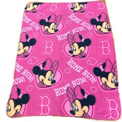 Snuggle up with your favorite Disney character and support your favorite team with this cozy fleece blanket featuring...