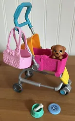 There are two ways to travel: seat one puppy in the stroller or in Barbie dolls handbag; or pull the front of the...