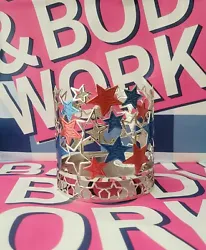 Enhance your patriotic décor with this stunning Bath and Body Works Patriotic Stars 3-Wick Candle Holder. The metallic...