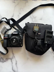 Nikon D850 with Nikon 50mm 1.4 Lens. Camera is like new and includes one battery, charger can case as shown in the...