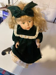 Antique Porcelain doll which has been on a shelf for years 