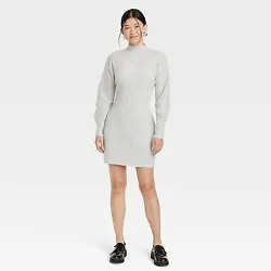 •Long-sleeve sweater dress in solid hue •Ribbed construction with stretch •Mock turtleneck •Mini length...
