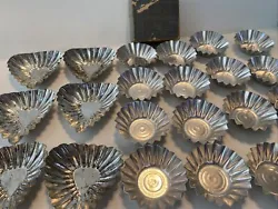 Vintage metal molds.The round one has 15 in the set and look like they have never been used. They measure about...