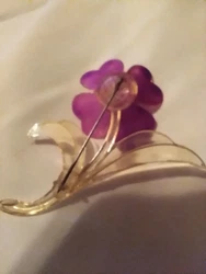 vintage celluloid flower brooch.