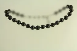 Material: BLACK GLASS FACETED BEAD. Form: NECKLACE.
