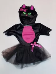 It includes a dress that does have an attached tail and hat with the cat face and ears on it. It is in very good...