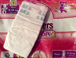 The diaper has a soft plastic backing and is a size Maxi for babies 18-40 lbs.