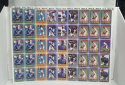 This is an in cut sheet of those cards. Corners have a little wear. It have 4x Derek Jeter, 10x Griffey Jr, 4x Cal...