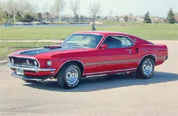 Collectable print ads, and photos, of the famous Ford Mustang Mach 1s, and Shelby G.T.s. There are five photos Grey...