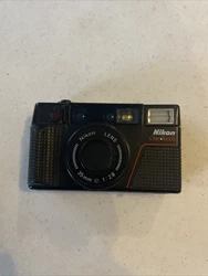 Nikon One Touch 35mm f/2.8 Point & Shoot Film Camera Untested. I did not put film in it to test it but it did not turn...