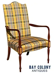 20TH CENTURY SHERATON ANTIQUE STYLE MAHOGANY & BIRDS EYE MAPLE UPHOLSTERED LOLLING CHAIR / EASY CHAIR. The chair has a...
