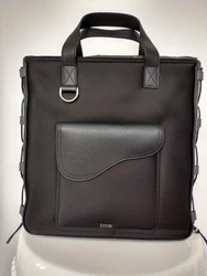 You are buying this Authentic Christian Dior Black Nylon North - South Saddle Tote. The Saddle tote bag has a modern...