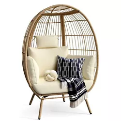Cozy lounger - Topped with soft padded cushions, lumbar and headrest pillows, this basket chair enhances the overall...