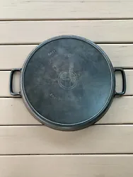 Griswold #20 hotel cast iron skillet. No cracks or repairs and it sits flat on my glass top stove. Heat ring is nice...