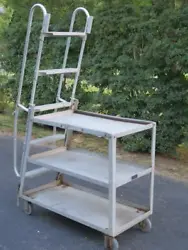 This listing is for one used older Rol-Away Truck Manufacturing Co. Model S7 Aluminum Rolling Ladder Portable 3 Shelf...
