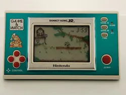 Vintage hand-held game and watch from Nintendo.  Donkey Kong JR.  Working just fine!  Please see pics!  Has a...