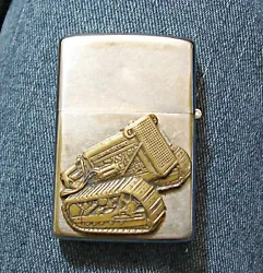 Here is a used 1963 Zippo lighter with a John Deere medallion on the back side and on the front a engraved John Deere...
