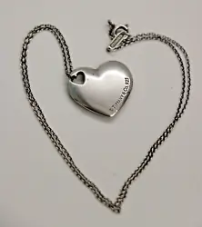 This lovely Tiffany Pendant is the. correct signed Tiffany necklace. heart in heart style. Also has the.