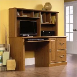 This desk with hutch includes convenient storage behind the panel door for a CPU tower. With its Carolina Oak® finish,...