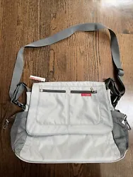 Skip Hop Messenger Bag - Light Gray and Red. This bag was a Floor Sample, so it has been touched by other people....