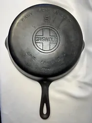 This beautiful vintage cast iron frying pan is in great condition. It has a very slight wobble on some surfaces. 