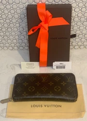Used Authentic Zippy Louis Vuitton Monogram Wallet. Theres wear and tear on the wallet that is shown in the photos....