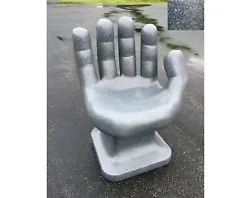 For sale is a NEW GIANT right Hand Shaped Chair. The plastic has a stone-like appearance. The plastic is solid colored...