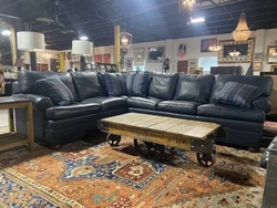 This Ethan Allen Bennett Roll-Arm leather sleeper sectional is a stylish and comfortable addition to any home. The...