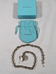 Tiffany & Co. Weighs 64g and is 17