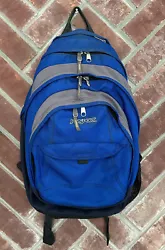 This Jansport backpack has a solid blue pattern and is made of durable polyester material with a lining of canvas and...